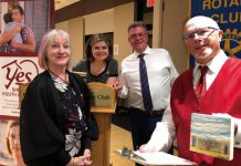 The Rotary Club of Peterborough held its annual dinner and auction charity fundraiser at Peterborough Golf & Country Club on April 28, 2023, raising $25,000 for YES Shelter for Youth and Families through a silent and live auction that included original encaustic painting by Rotarian Susan Fisher (left). Also pictured are Rotarian Catherine Hanrahan who emceed the event, auctioneer Rob Rusland, and Rotarian Bruce Gravel, who co-chaired the event with Rotarian Amy Simpson. (Photo: Frances Gravel)