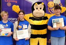 Buzz the Spelling Bee mascot with the top three spellers in the senior division (grades 7 and 8) at the Rotary Club of Peterborough's ninth annual School Spelling Bee held on May 13, 2023. From left to right: Crepe Cochrane (third), Sonny Gillis (second), and Noah Hofman (first). (Photo courtesy of Rotary Club of Peterborough)