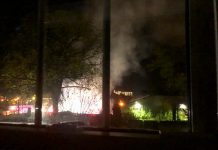 A Peterborough resident living on the south side of Dalhousie Street took this photo from an uptairs window of a late-night fire at at the Wolfe Street encampment in downtown Peterborough on May 18, 2023. (Photo supplied to kawarthaNOW)