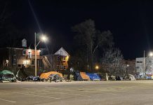 Some of the tents pitched by unsheltered people at the Rehill parking lot in December 2022 near the City of Peterborough's overflow shelter at 210 Wolfe Street in downtown Peterborough. The tent encampment has created a range of issues for homeowners and business owners in the area. (Photo: Matt Crowley / Twitter)