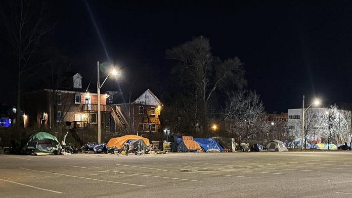 Some of the tents pitched by unsheltered people at the Rehill parking lot in December 2022 near the City of Peterborough's overflow shelter at 210 Wolfe Street in downtown Peterborough. The tent encampment has created a range of issues for homeowners and business owners in the area. (Photo: Matt Crowley / Twitter)