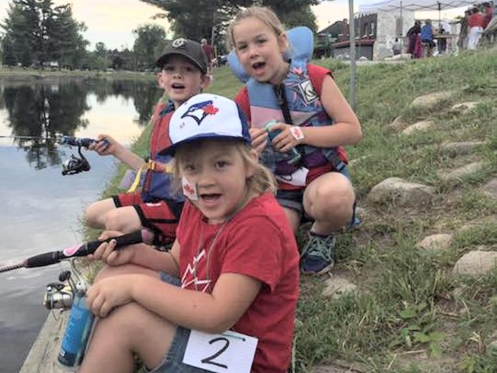 Children enjoy fishing at the Canada Day Kids' Fishing Derby in Minden. (Photo: Canada Day Kids' Fishing Derby Haliburton Highlands / Facebook)