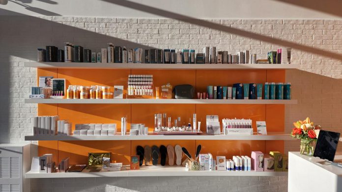 The product wall at The Ten Spot Peterborough features professional high-end products and brands, some of which can only be purchased online. The Ten Spot's aestheticians provide free skin consultations. (Photo courtesy of The Ten Spot Peterborough)
