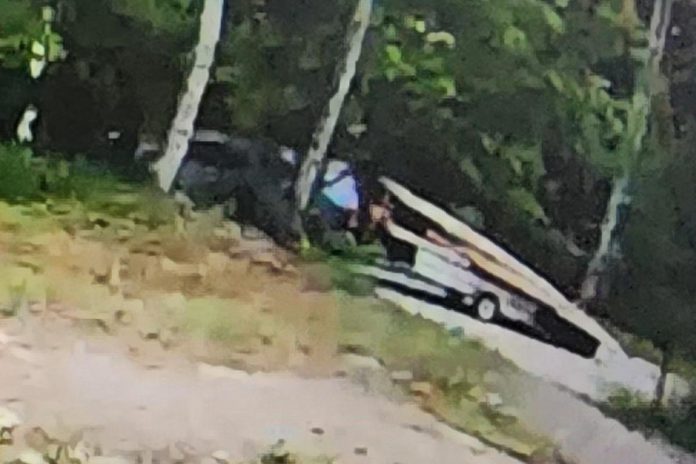 A security camera captured an image of what appears to be a light-coloured SUV or pickup truck with a cap towing a trailer with the dock loaded on it shortly after 6 a.m. on June 17, 2023. (Police-supplied photo)