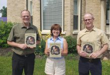 Peterborough author Erica Richmond (middle) with Peterborough Youth Services child and youth mental health program director Matt Sheridan (left) and executive director Gordon Langill with copies of Richmond's children's book "Pixie and the Bees". Richmond raised $670 for the organization by donating half of the proceeds of sales of the book during May 2023. (Photo courtesy of Erica Richmond)