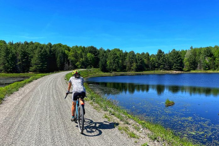 As the flattest place in the Haliburton Highlands to ride, the 32-kilometre Haliburton County Rail Trail is a perfect choice for first-time or casual cyclists. It offers many different destinations for cyclists, and you can depart from various parking areas and destinations to create your own out-and-back trip.  (Photo courtesy of Haliburton Highlands Economic Development & Tourism)