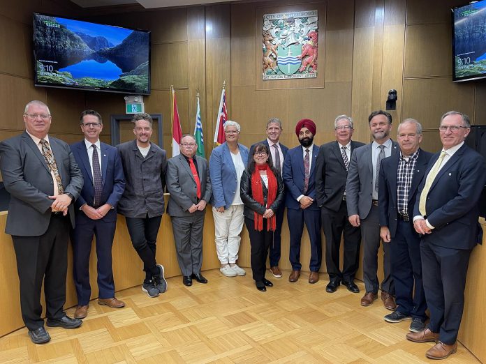 The City of Peterborough's new chief administrative officer Jasbir Raina (fifth from right) with Peterborough city council after his appointment was approved by council on June 5, 2023. (Photo courtesy of City of Peterborough)