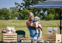 Havelock resident Meg Kynock, founder and owner of muttmixx, with her beloved powderpuff Kevin Bacon on June 18, 2023 at the Quinte Ride for Paws Poker Run fundraiser. Kynock developed her muttmixx pet treats two years ago to help Kevin recover after he was attacked by another dog and almost lost his leg. (Photo courtesy of Amy Deroche www.derochesportsphotography.com)