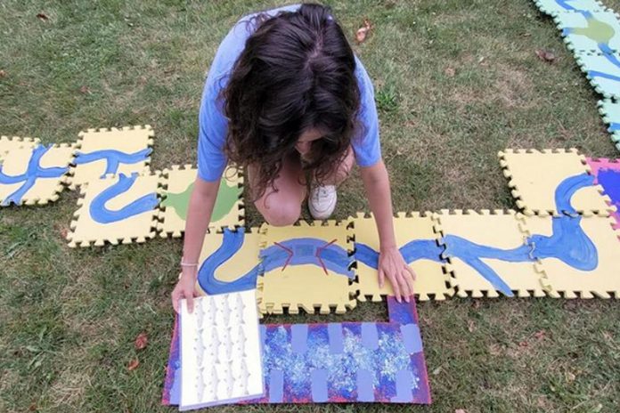 Led by Kelsey Roote and Ziigwan LaPointe from TRACKS Youth Program, the engaging River Race game explores the journey of different fish in the Trent-Severn Waterway and the challenges they have getting to their spawning grounds. (Photo courtesy of New Canadians Centre)