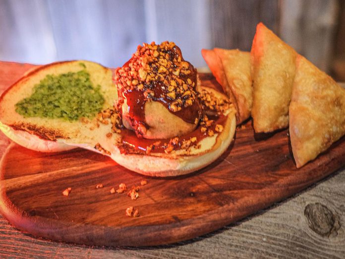 Dirty Burger is one of 10 downtown Peterborough restaurants participating in the New Canadians Centre's 2023 Multicultural Food Crawl during the month of June.  For the free sampling day on June 24, Chef Om Patel will be serving up vadas, a potato patty fried in a chickpea batter and served with on chutney. (Photo courtesy of Dirty Burger)
