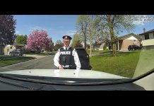 Peterborough police chief Stuart Betts demonstrates the in-car camera system that has been installed in 25 police vehicles, including all marked cruisers and some unmarked crusiers. The system will record audio and video for front-facing activity outside the vehicle and within the prisoner-control area of the rear seat, with the forward-facing cameras connected to a microphone an officer wears that captures all audio communication when the in-car camera system is active. (kawarthaNOW screenshot)