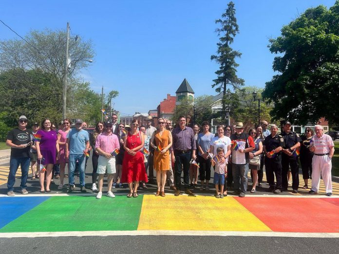 Port Hope mayor Olena Hankivsky, councillors, staff, and members of the community gathered on June 1, 2023 for the official ribbon-cutting ceremony of the new rainbow crosswalk on Queen Street. (Photo: Port Hope Police Service / Facebook)