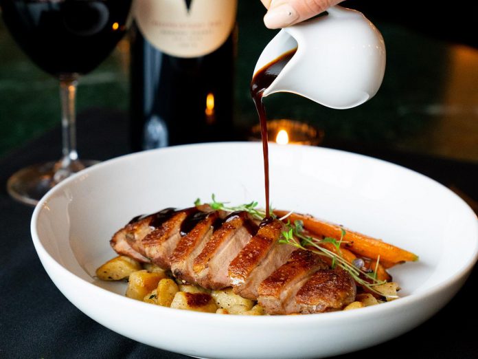 The sous vide King Cole duck at Rare Restaurant and Bar features housemade truffle gnocchi and roasted baby carrots. Along with the new menu, Rare also has daily specials including happy hours from 4 to 6 p.m. Monday through Saturday and an occasional Sunday brunch buffet. (Photo courtesy of Rare Restaurant and Bar)