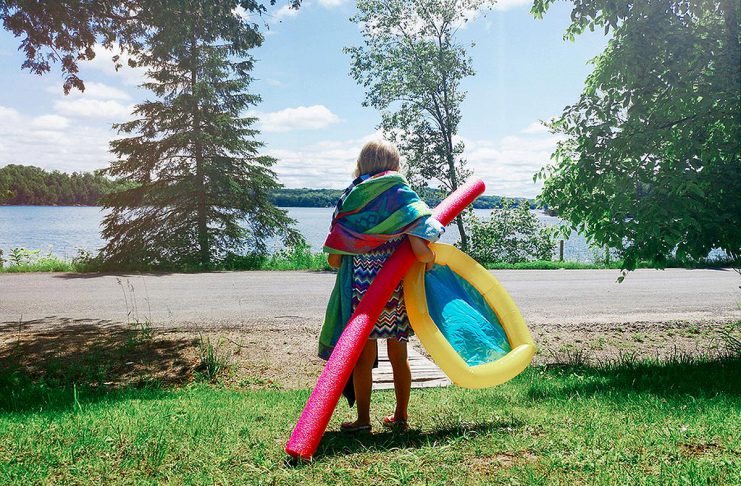 The Beach Report for August 28, 2026 A young girl with gear during summer heading to a beach for a swim. (Stock photo)