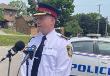 Peterborough police chief Stuart Betts addresses the media in the parking lot across from the Wolfe Street overflow shelter for people who are homeless. A woman in the Wolfe Street tent encampment was shot and later died in hospital in the early morning hours of June 2, 2023. (Photo: Paul Rellinger / kawarthaNOW)