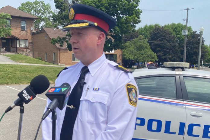 Peterborough police chief Stuart Betts addresses the media in the parking lot across from the Wolfe Street overflow shelter for people who are homeless. A woman in the Wolfe Street tent encampment was shot and later died in hospital in the early morning hours of June 2, 2023. (Photo: Paul Rellinger / kawarthaNOW)