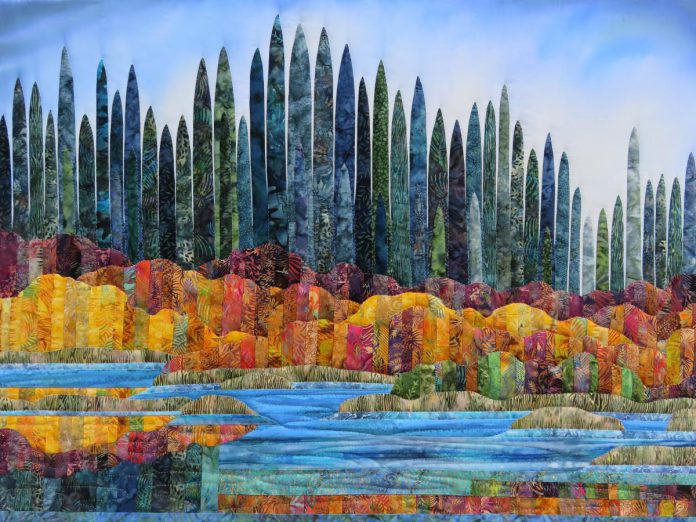 "Northland Harmony" (2022, textiles, painted cotton and batiks) by Lakefield-based artist Stephanie Ford Forrester, one of the 47 artists participating in the 39th annual Kawartha Autumn Studio Tour. The self-guided tour, organized by the Art Gallery of Peterborough, runs from 10 a.m. to 5 p.m. on September 23 and 24, 2023, and takes visitors to 36 studios across the Peterborough-Kawarthas region. (Photo courtesy of Art Gallery of Peterborough)