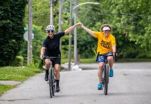 Two of the more than 60 cyclists and volunteers who participated in the Canadian Mental Health Association Haliburton, Kawartha, Pine Ridge's 'Change the Cycle' fundraiser at Nicholls Oval Park in Peterborough on June 24, 2023. The event raised over $40,000 for the organization's supportive housing Garden Homes Project, which aims to support vulnerable people at risk of homelessness in the Peterborough area by providing affordable, small homes. (Photo courtesy of CMHA HKPR)