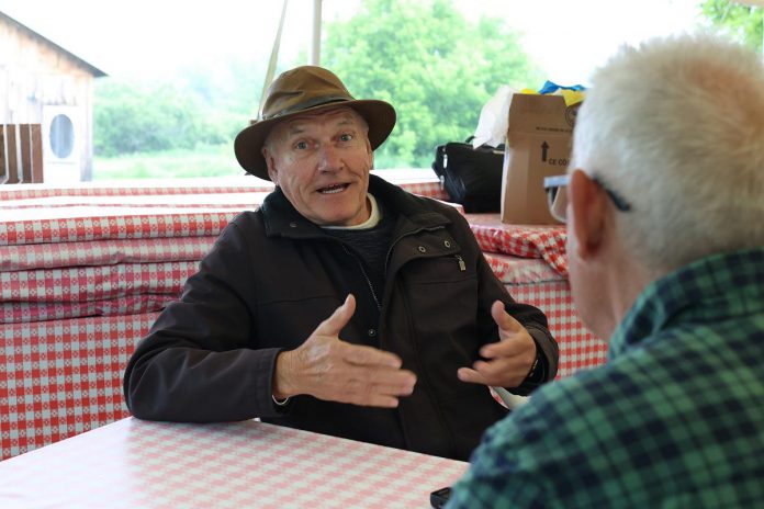 D'Arcy Jenish speaks about his play "The Tilco Strike" with kawarthaNOW writer Paul Rellinger during 4th Line Theatre's media day on June 14, 2023. The play runs Tuesdays to Saturdays until July 22. (Photo: Heather Doughty / kawarthaNOW)