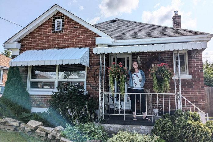 Deanna VandenBroek moved into a 1940s bungalow in Peterborough with an oil furnace, a mostly uninsulated basement, and an attic with less than half of the insulation of today's building code. She now has a heat pump, hot water heater, and insulation which is up to code, and has reduced her greenhouse gas emissions by 90 per cent. (Photo: Clara Blakelock / GreenUP)