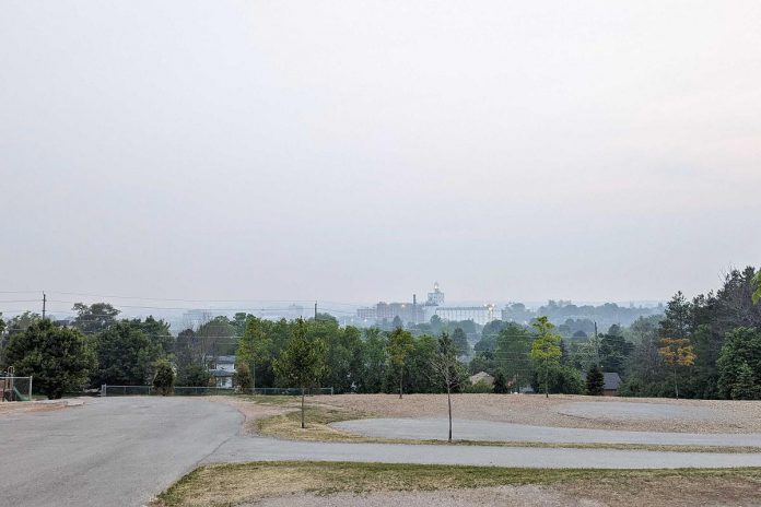 A photo of wildfire smoke over the City of Peterborough from the top of Armour Hill, taken by GreenUP Home Energy Advisor Collin Richardson, whose role is to assess your home's energy efficiency and recommend retrofits that decrease greenhouse gas emissions and also save energy.  (Photo: Collin Richardson / GreenUP)