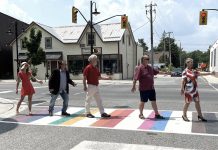 Members of Sewlyn Township council have a little fun after Peterborough County in collaboration with Selwyn Township officially unveiled an all-inclusive Pride crosswalk at the corner of Reid and Queen streets in the Village of Lakefield on July 17, 2023. (Photo: Selwyn Township Deputy Mayor Ron Black / Twitter)