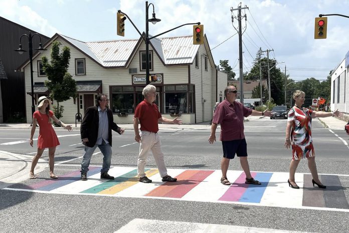 Members of Sewlyn Township council have a little fun after Peterborough County in collaboration with Selwyn Township officially unveiled an all-inclusive Pride crosswalk at the corner of Reid and Queen streets in the Village of Lakefield on July 17, 2023. (Photo: Selwyn Township Deputy Mayor Ron Black / Twitter)