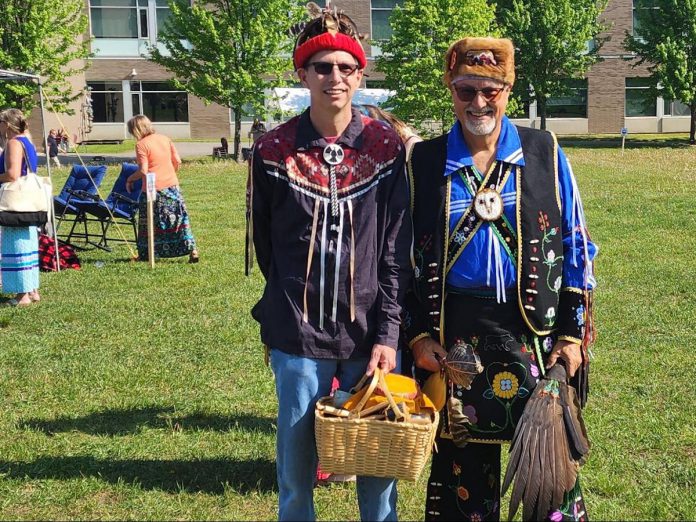 On June 1, 2023, Bracebridge and Muskoka Lakes Secondary School hosted the first annual Trillium Lakelands District School Board Powwow and Drum Social to kick off the start of National Indigenous Peoples' Month. Odawa Anishinaabe Metis Knowledge Holder Larry O'Connor (right), Elder Christopher Stock from Wahta Mohawks First Nation (left), and Oshkaabewis Dave Rice of Wasauksing First Nation (not pictured) participated in the event where students, staff, parents and guardians, and community members were invited to learn about basic traditions, protocols, dances, and music. (Photo courtesy of Trillium Lakelands District School Board)
