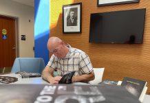 Peterborough author Matthew Flagler with copies of his new book "Held to the Fire," which he calls an authentic retelling of the most tragic event in the city's history: the 1916 explosion and fire that destroyed the Quaker Oats plant on Hunter Street and claimed the lives of 24 workers. (Photo courtesy of Matthew Flagler)