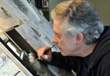 Internationally renowned Buckhorn-based wildlife artist Michael Dumas in studio working on his 2017 oil painting "Looking Out" featuring an eastern phoebe in a flour mill. Artists for Conservation, the world's leading group of artists supporting the environment, has selected Dumas to receive the Simon Combes Conservation Artist Award. (Photo courtesy of Michael Dumas)