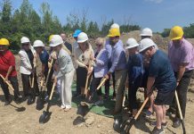 Ontario Minister of the Environment, Conservation and Parks David Piccini (second yellow hard hat from right) joined a number of local dignitaries for a groundbreaking ceremony on July 5, 2023 at the site of the new Ontario Turtle Conservation Centre in Peterborough. Siblings Mary and Gerry Young have donated their family's 100-acre property off Television Road for the new centre, which is scheduled to open in July 2024. (Photo: Paul Rellinger / kawarthaNOW)