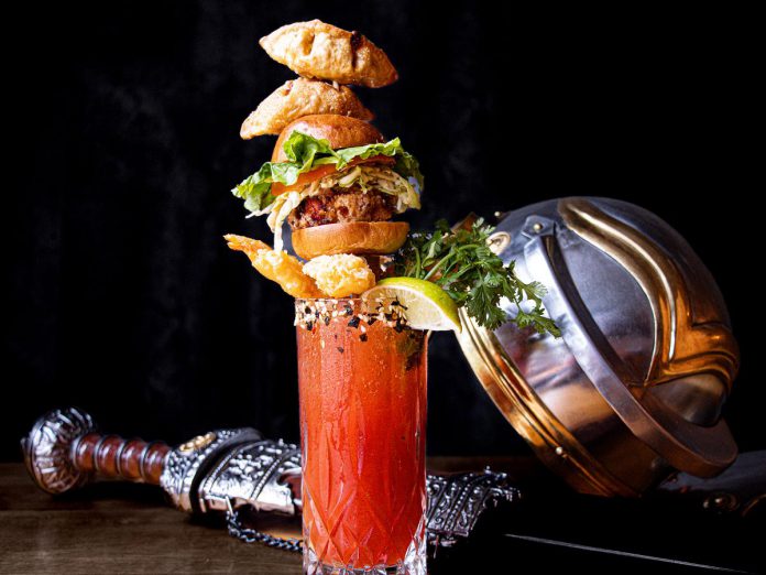 Inspired by the flavours of Japan, Naka Japanese Restaurant's Shogun Caesar features house-made hot sauce, shochu, Worcestershire, lemon juice and Clamato, rimmed with a Furikake seasoning with sesame and seaweed and topped by a skewer of Karaage slider, pork gyoza, shrimp tempura, and cilantro. (Photo courtesy of Peterborough DBIA)