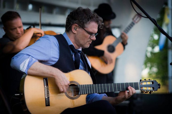 Canadian virtuoso guitarist Jesse Cook, pictured performing at Peterborough Musicfest in July 2017, returns to Musicfest to perform a free-admission concert in Del Crary Park on July 19, 2023. (Photo: Peterborough Musicfest)