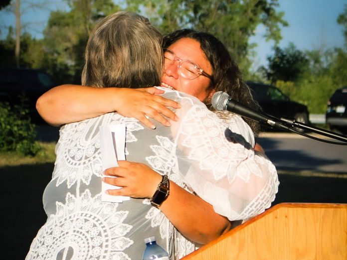 At last year's "Rebel with a Cause" event, honouree Elizabeth Stone, an Indigenous knowledge leader at Fleming College, receives a hug from Chief Laurie Carr of Hiawatha First Nation. The other two honourees were Anishnaabe Kwe spoken word artist Sarah Lewis and EFry volunteer and  activist Marisa Mackenzie. (Photo courtesy of EFry Peterborough)