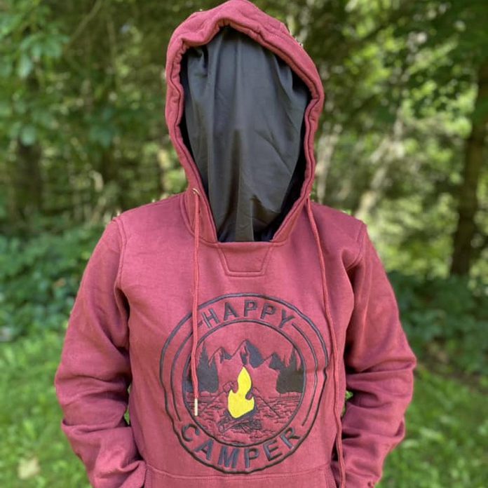 13-year-old Haliburton Highlands resident Olivia Irvine has found a business niche catering to the needs of both locals and visitors who enjoy camping and the outdoors. Her Roasty Toasty Campfire Company "Happy Camper" hoodies are available with a built-in bug screen.  (Photo courtesy of Roasty Toasty Campfire Company)