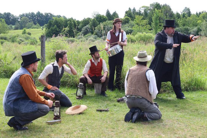 Actors Logan Coombes, Colin A. Doyle, Mark Hiscox, Josh Lambert, Robert Morrison, and Kelsey Powell perform a scene from "The Cavan Blazers" during 4th Line Theatre's media day on July 19, 2023. The play, which chronicles the 19th-century conflict between Cavan Township's Protestant and Catholic Irish settlers, runs Tuesdays to Saturdays from August 1 to 26 at the Winslow Farm in Millbrook. (Photo: Heather Doughty / kawarthaNOW)
