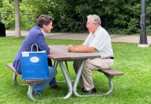 Prime Minister Justin Trudeau sits with Mayor Jeff Leal at a picnic table in Millennium Park during a visit to Peterborough on July 20, 2023. (Photo: City of Peterborough / Twitter)