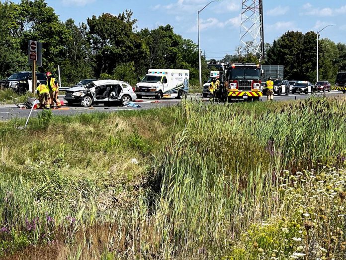 Peterborough County Ontario Provincial Police (OPP) and emergency crews at the scene of a serious single-vehicle collision on Highway 115 in Peterborough on August 9, 2023. (OPP-supplied photo)