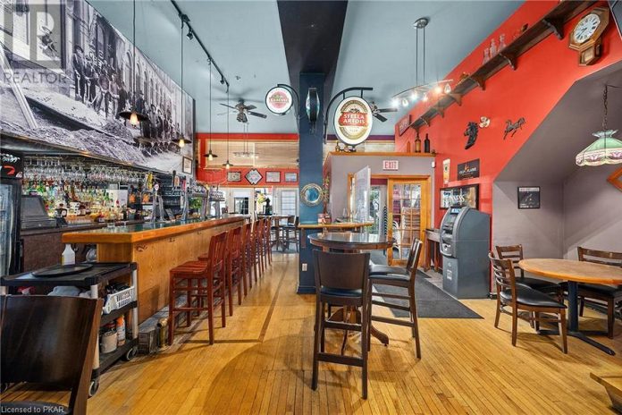 The 2,600-square-foot pub and restaurant, with seating for 126 patrons, a sidewalk patio, and three upper floor apartment units, opened in 2005 and has been home to regular live entertainment ever since.  (Photo: REALTOR.ca)