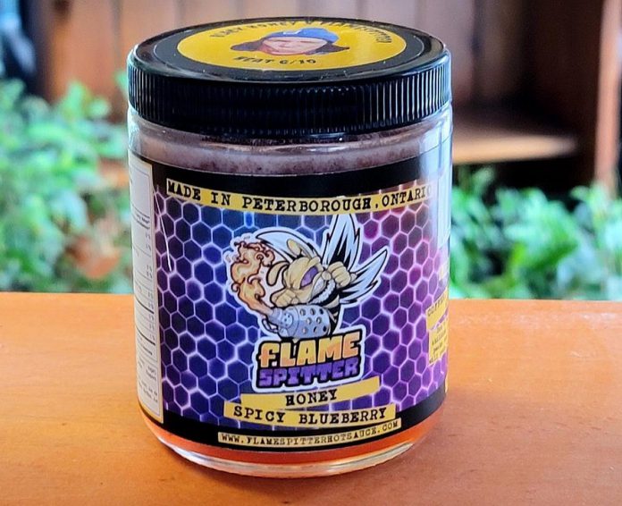 Mitchell Lowes is expanding the products offered by Flame Spitter Hot Sauce, including with this spicy blueberry honey created in collaboration with Peterborough's Black Honey Bakery. (Photo courtesy of Black Honey Bakery)