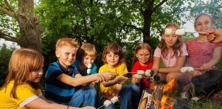 What’s open and closed on the 2026 Civic Holiday A group of children roasting marshmallows over a campfire. (Stock photo)