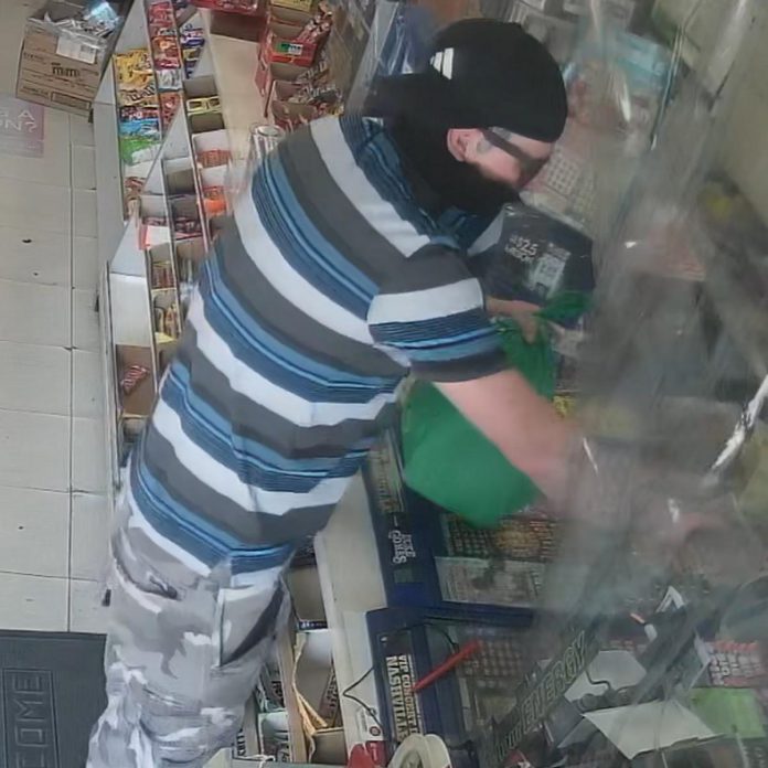 Surveillance video of a suspect in an armed robbery of a store on Colborne Street in Fenelon Falls at around 4:30 p.m. on August 17, 2023. (Police-supplied photo)