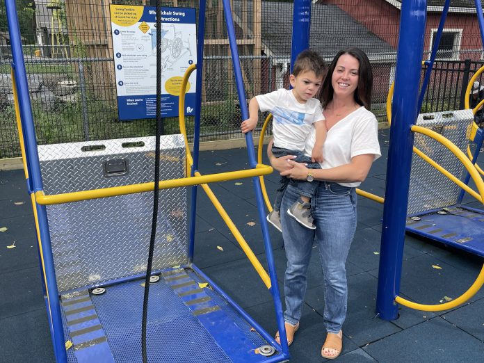 Julie Grant, shown holding her son Jude, is a big advocate for more accessible playgrounds and inclusive play structures, like the wheelchair swing at Peterborough’s Riverview Park and Zoo. (Photo courtesy of Five Counties Children's Centre)