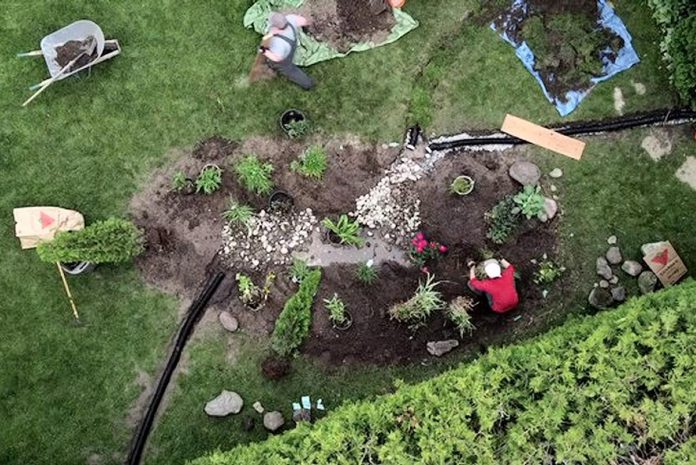An aerial shot of a rain garden being installed at a Peterborough property. Both front yard and backyard rain gardens are eligible for the City of Peterborough's Rain Garden Subsidy Program, which provides funding to eligible property owners, including homeowners, businesses, and organizations.  (Photo: GreenUP)
