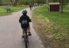 A student-led bike club rides through Rogers Cove park in Peterborough's East City. Active school travel helps school-aged children meet the recommendation to accumulate at least 60 minutes per day of moderate to vigorous physical activity, which is associated with improved physical and mental health. (Photo: GreenUP)