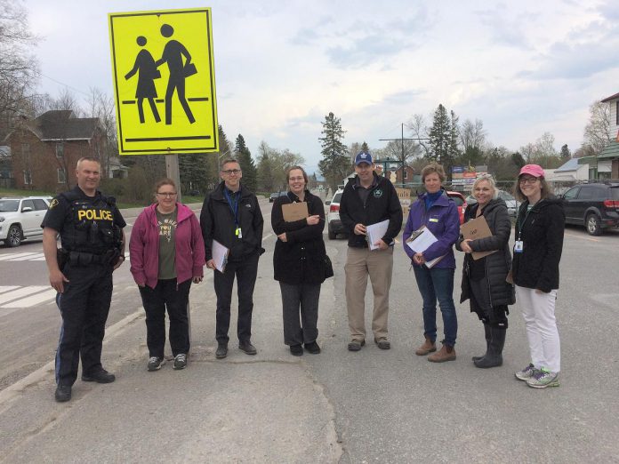 School travel planning took place in Norwood with community partners including the municipality, enforcement, and the school board. Participatory methods such as this walkabout technique are used to conduct School travel planning with stakeholders and community members, weaving in active school travel principles. (Photo: GreenUP)