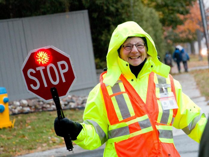 Peterborough's crossing guards are employees of the city. This year, GreenUP celebrated Peterborough crossing guards during Crossing Guard Appreciation Week. These dedicated guards undergo job training, police checks, and participate in in-depth traffic safety learning. (Photo: GreenUP)