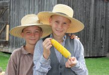 There will be plenty of fire-cooked corn smothered in butter for the entire family to enjoy during the Corn Roast event at Lang Pioneer Village Museum in Keene on August 27, 2023. Find out the many ways 19th-century settlers used corn, watch a variety of harvest-related and historic demonstrations, enter a corn-on-the-cob eating contest, and more. (Photo courtesy of Lang Pioneer Village Museum)