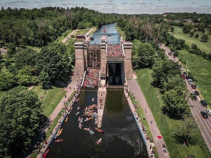 Last held from 2016 to 2019, Parks Canada's Lock & Paddle event returns to the Peterborough Lift Lock on August 26, 2023. Paddle alongside hundreds of canoes and kayaks along the Trent-Severn Waterway towards the world's tallest hydraulic lift lock, where the two tubs will be packed full as everyone is sent 65 feet (20 metres) in the air. (Photo: Parks Canada)