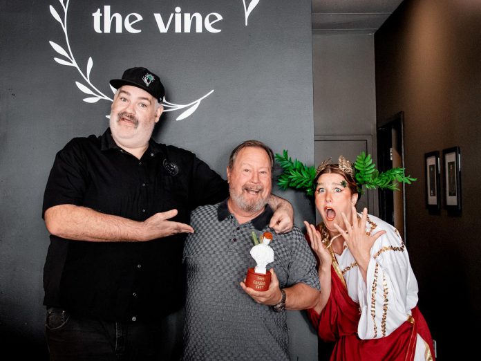 The Vine co-owner Tyrone Flowers (left) with "Papa Tom" (the inspiration behind the classic virgin Caesar that won The Vine the Caesar Fest trophy) during downtown Peterborough's first-ever celebration of Canada's favourite cocktail held during July. Also pictured is local performance artist Naomi Duvall, who was hired by the Peterborough Downtown Business Improvement Area (DBIA) to help promote the festival. (Photo courtesy of Peterborough DBIA)